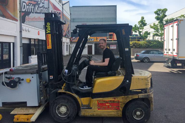 A Forklift Truck Transporting The Big Saw into the Workshop